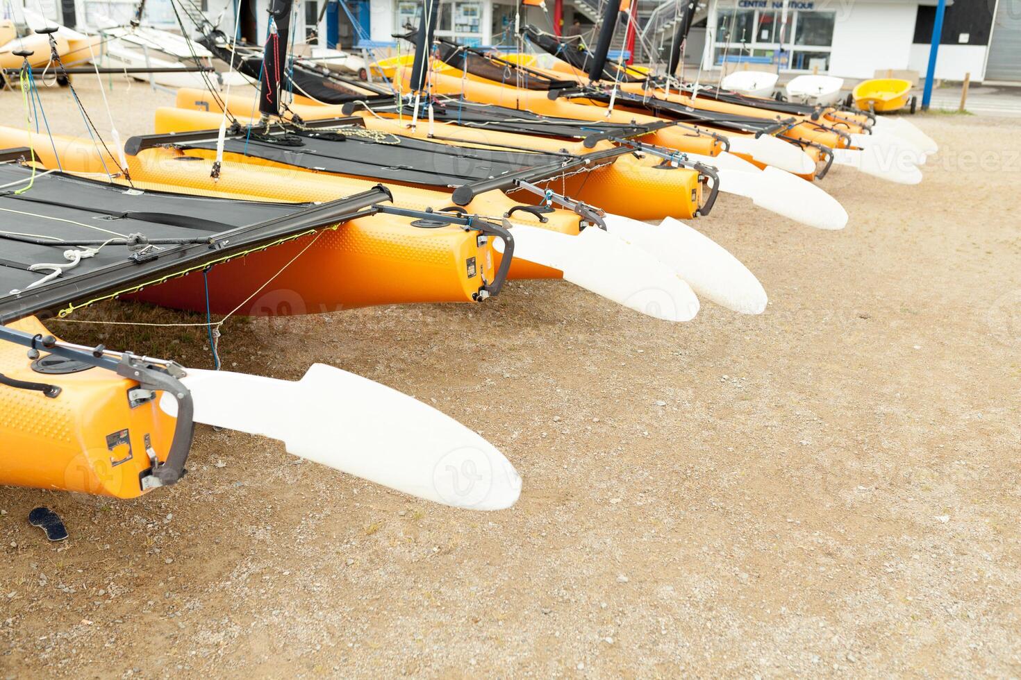 Morgat, France 29 May 2018 Catamarans storage without sails parked on the beach photo