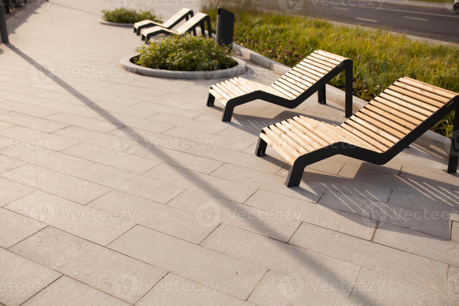 Sun loungers on the public park in the Moscow street photo