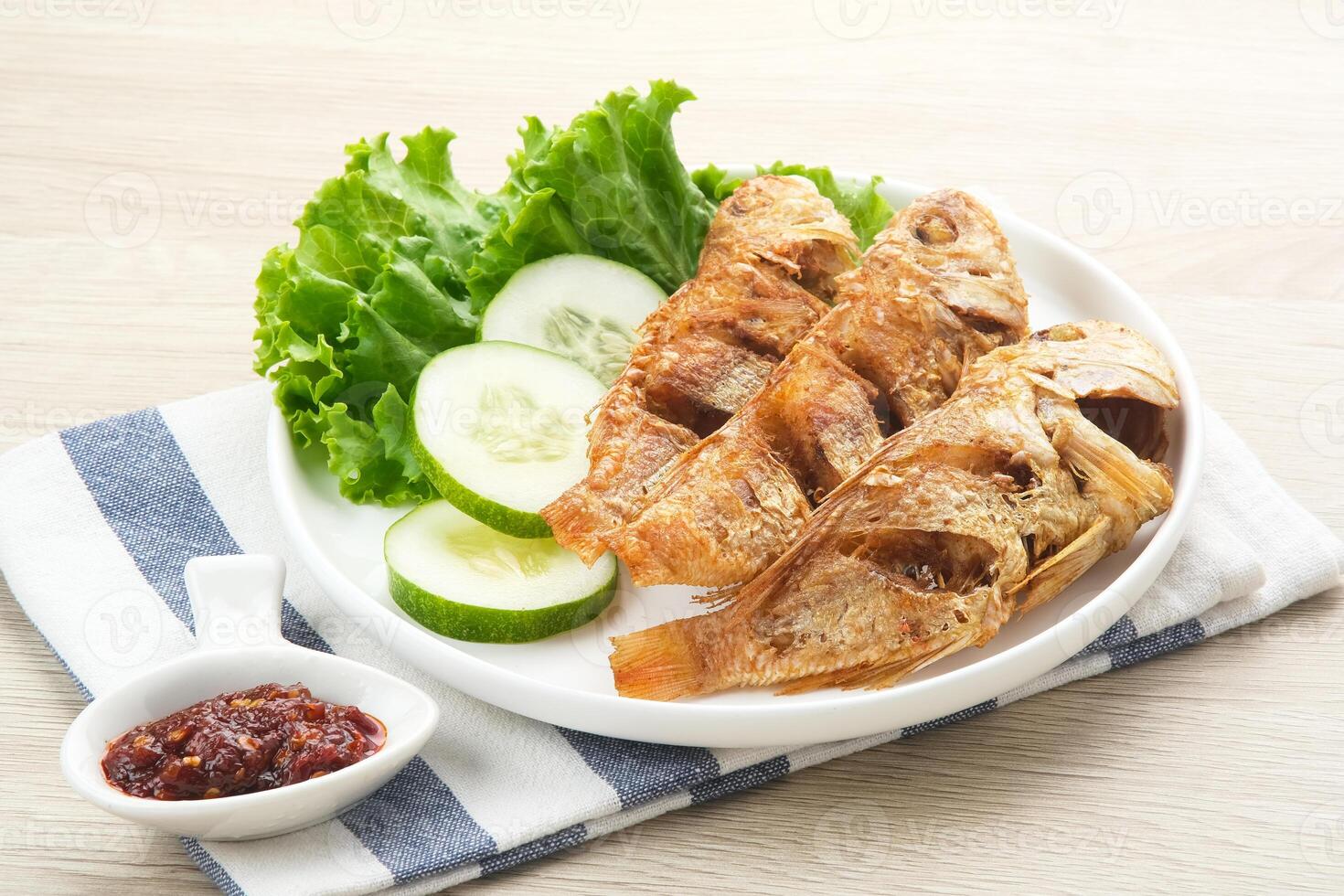 Ikan Laosan Goreng or Fourfinger threadfin fish, Indonesian food photo