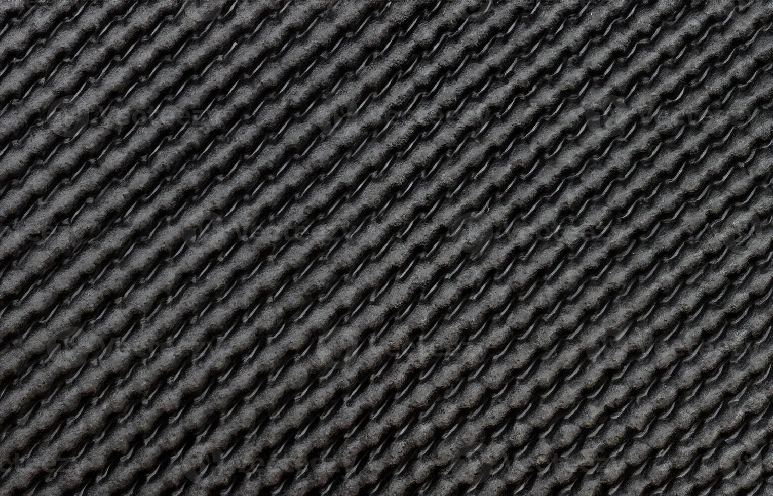 A close-up pattern background of rubber-textured carpet underlay. photo