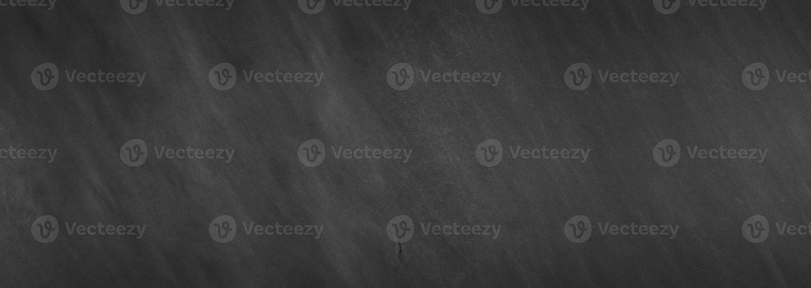 A dark-toned wallpaper featuring a blackboard wall backdrop with a chalkboard texture. photo