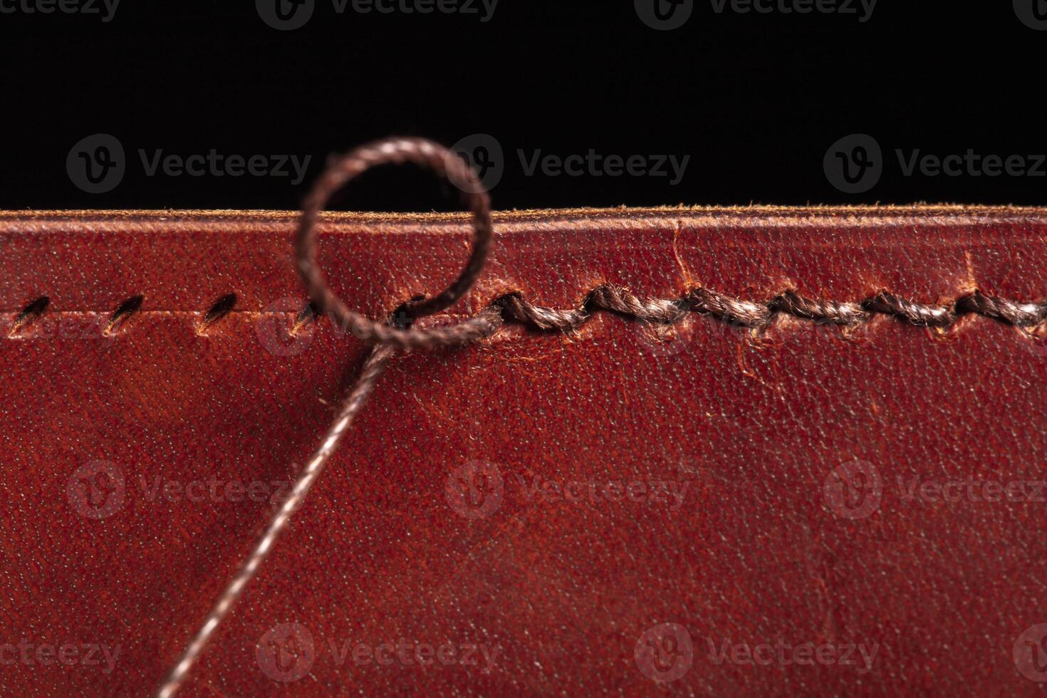 A stitching with threads on a leather product. photo