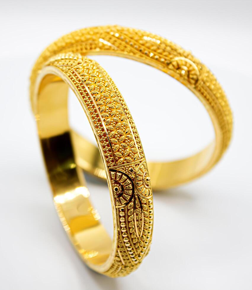 Indian design gold bangle isolated on white background photo