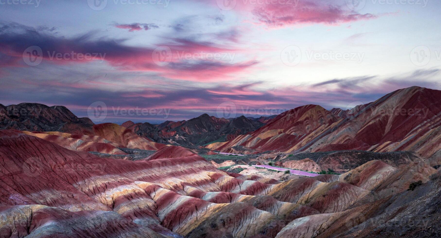 Amazing scenery of china mountains and blue sky background in sunset. Zhangye Danxia National Geopark, Gansu, China. Colorful landscape, rainbow hills, unusual colored rocks, sandstone erosion photo