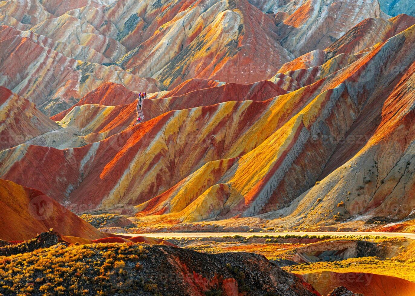 Amazing scenery of china mountains and blue sky background in sunset. Zhangye Danxia National Geopark, Gansu, China. Colorful landscape, rainbow hills, unusual colored rocks, sandstone erosion photo