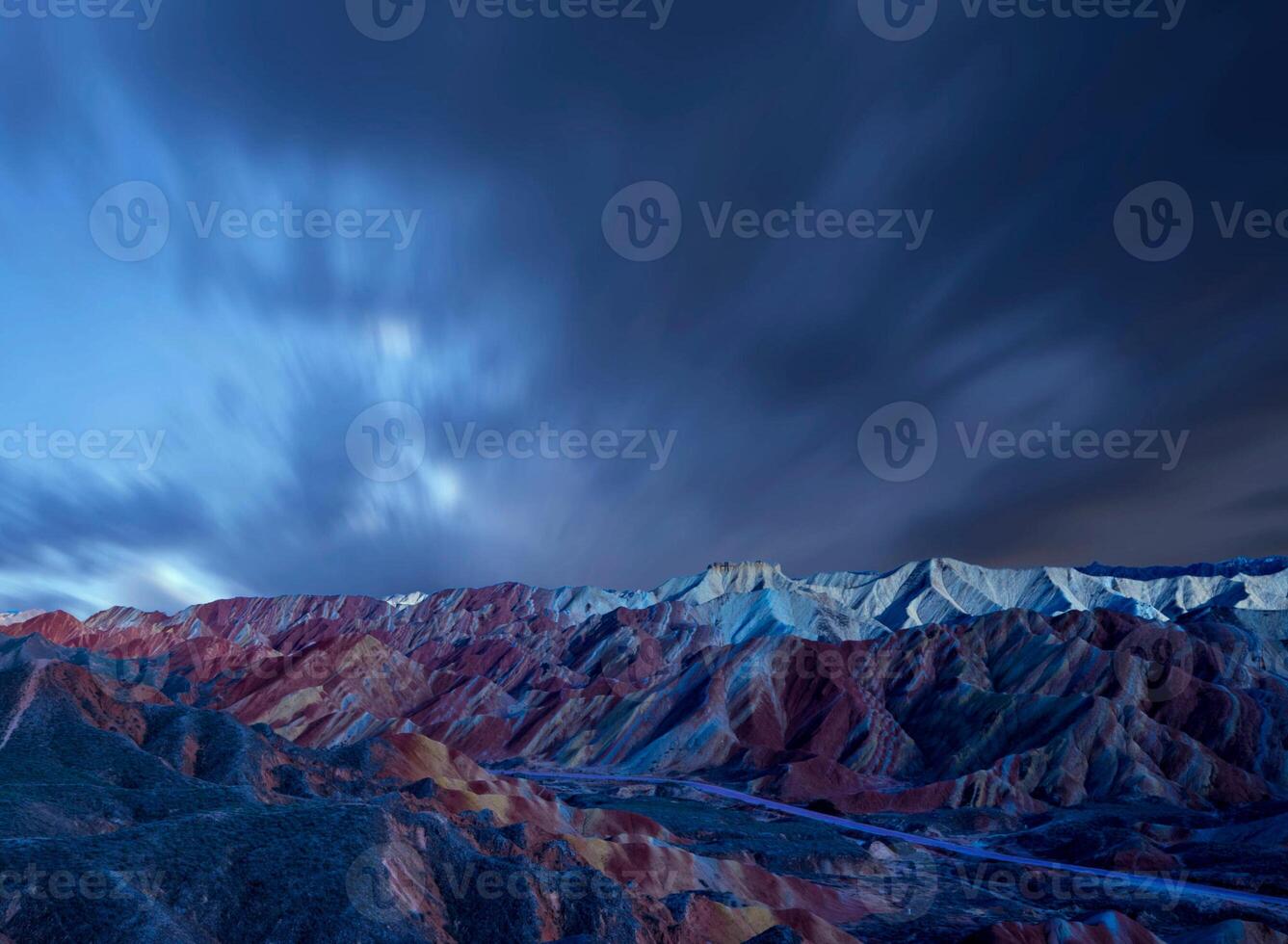 Amazing scenery of china mountains and blue sky background in sunset. Zhangye Danxia National Geopark, Gansu, China. Colorful landscape, rainbow hills, unusual colored rocks, sandstone erosion photo