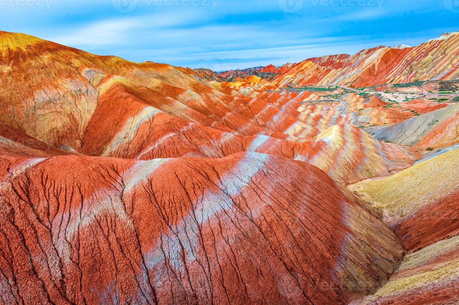 Amazing scenery of china mountains and blue sky background in sunset. Zhangye Danxia National Geopark, Gansu, China. Colorful landscape, rainbow hills, unusual colored rocks, sandstone erosion photo