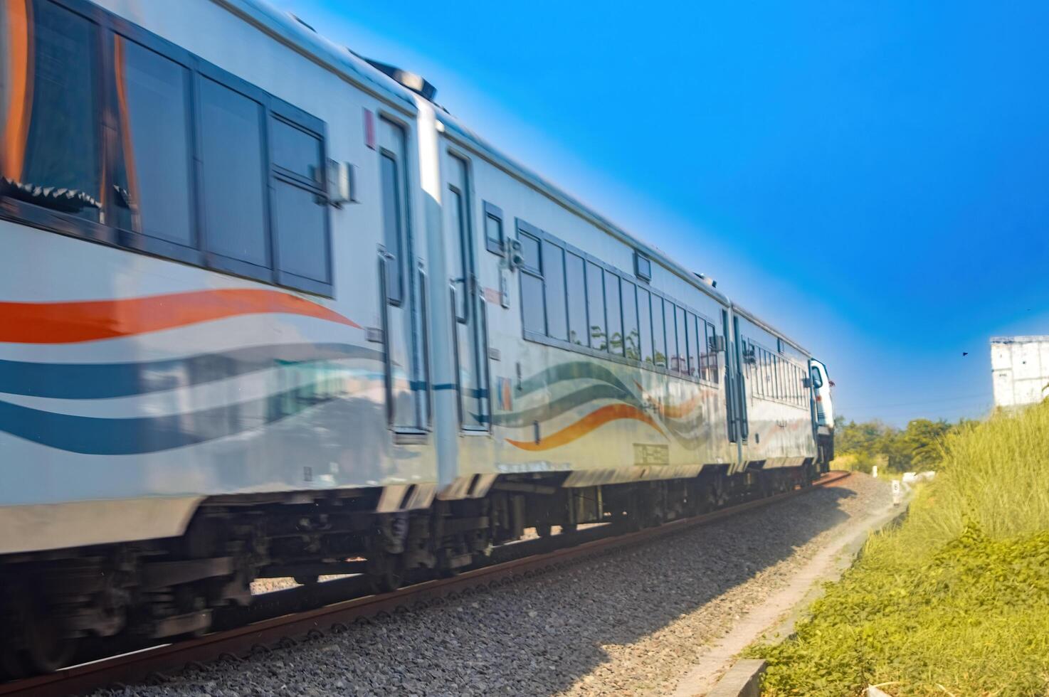 a series of fast-moving executive class trains pulled by a cc206 locomotive made by General Elektrik belonging to PT Kereta Api Indonesia, Indonesia, 28 October 2023. photo