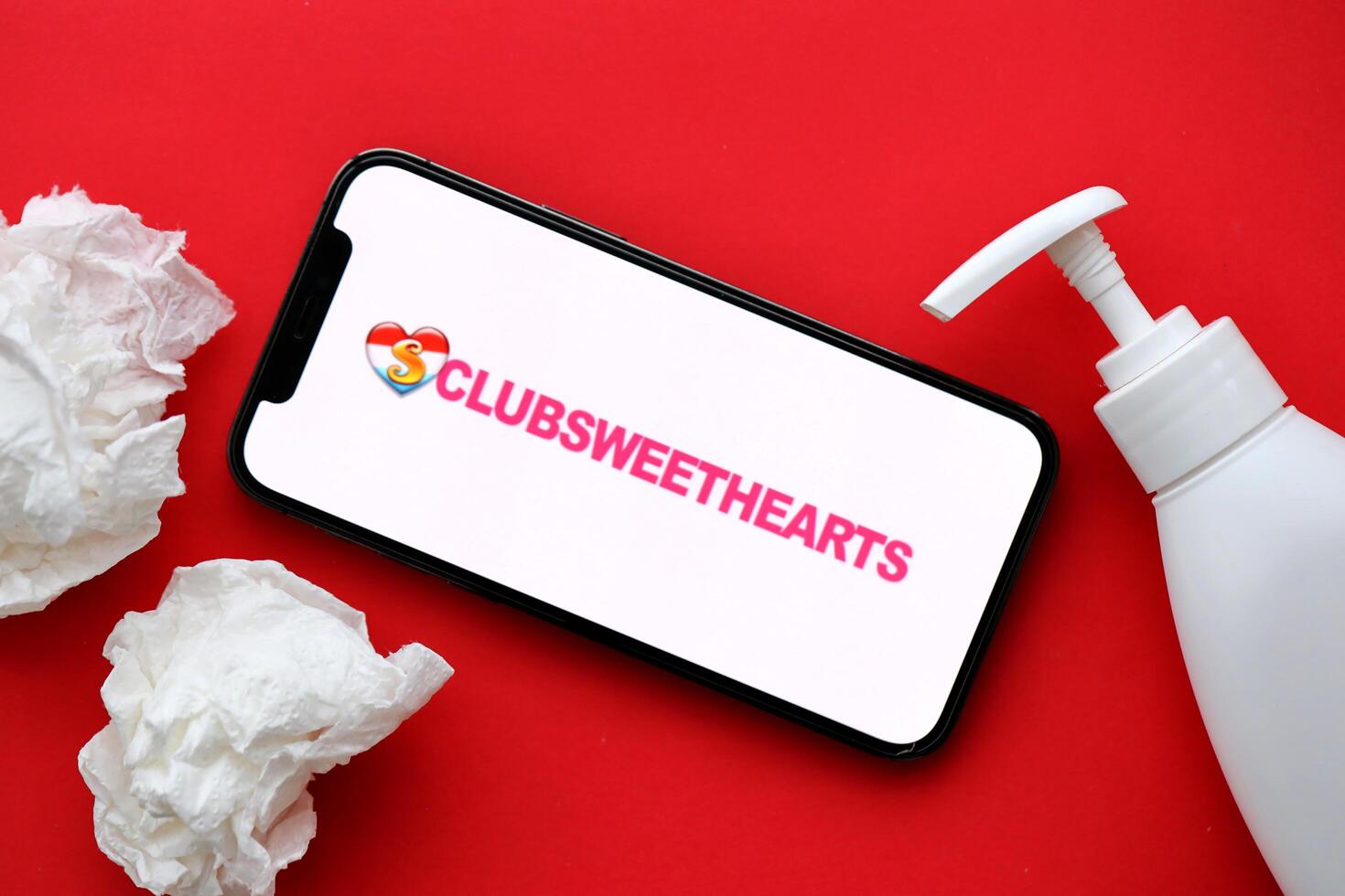 KYIV, UKRAINE - JANUARY 23, 2024 ClubSweetHearts adult content website logo on display of iPhone 12 Pro photo