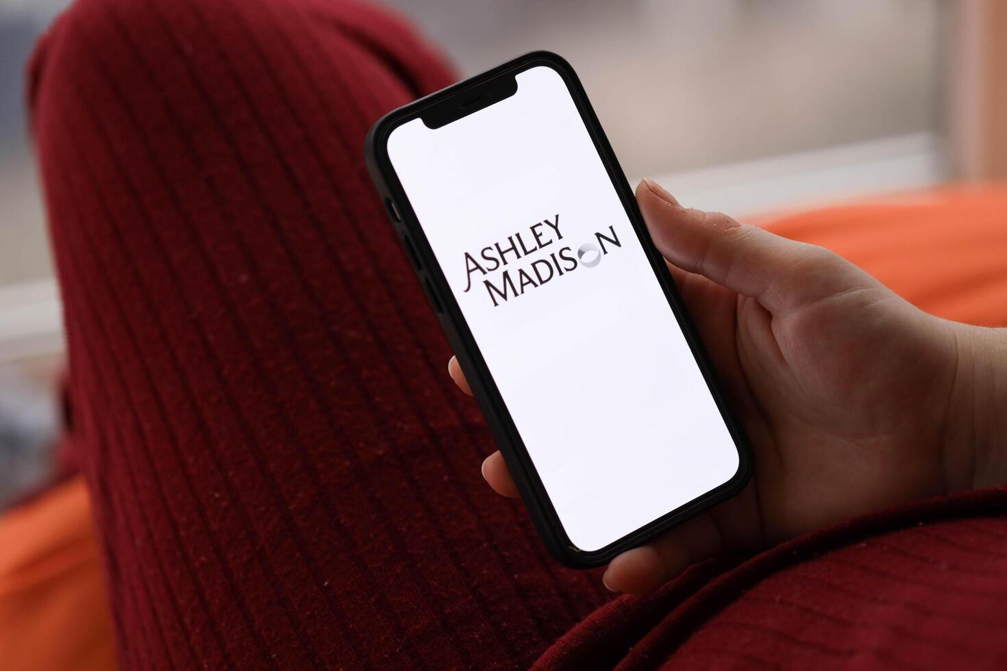 KYIV, UKRAINE - FEBRUARY 23, 2024 Ashley Madison logo of famous dating website or app on iPhone display photo