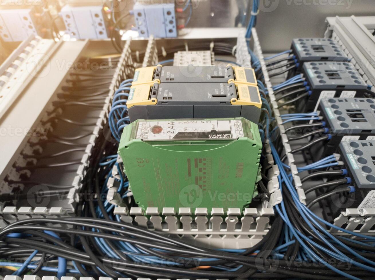 Terminal connection relay control, automatic relay control on the panel board manchinery, electrical service concept, electrical background. photo