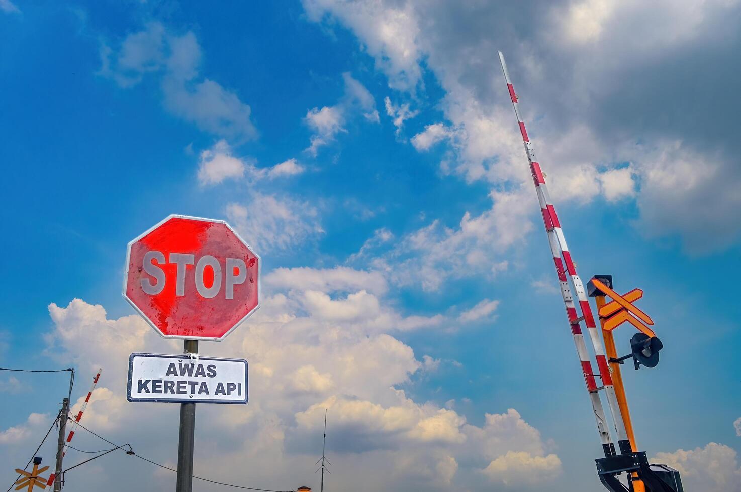 one package of stop signs and gate barriers at railway crossings in Indonesia. photo