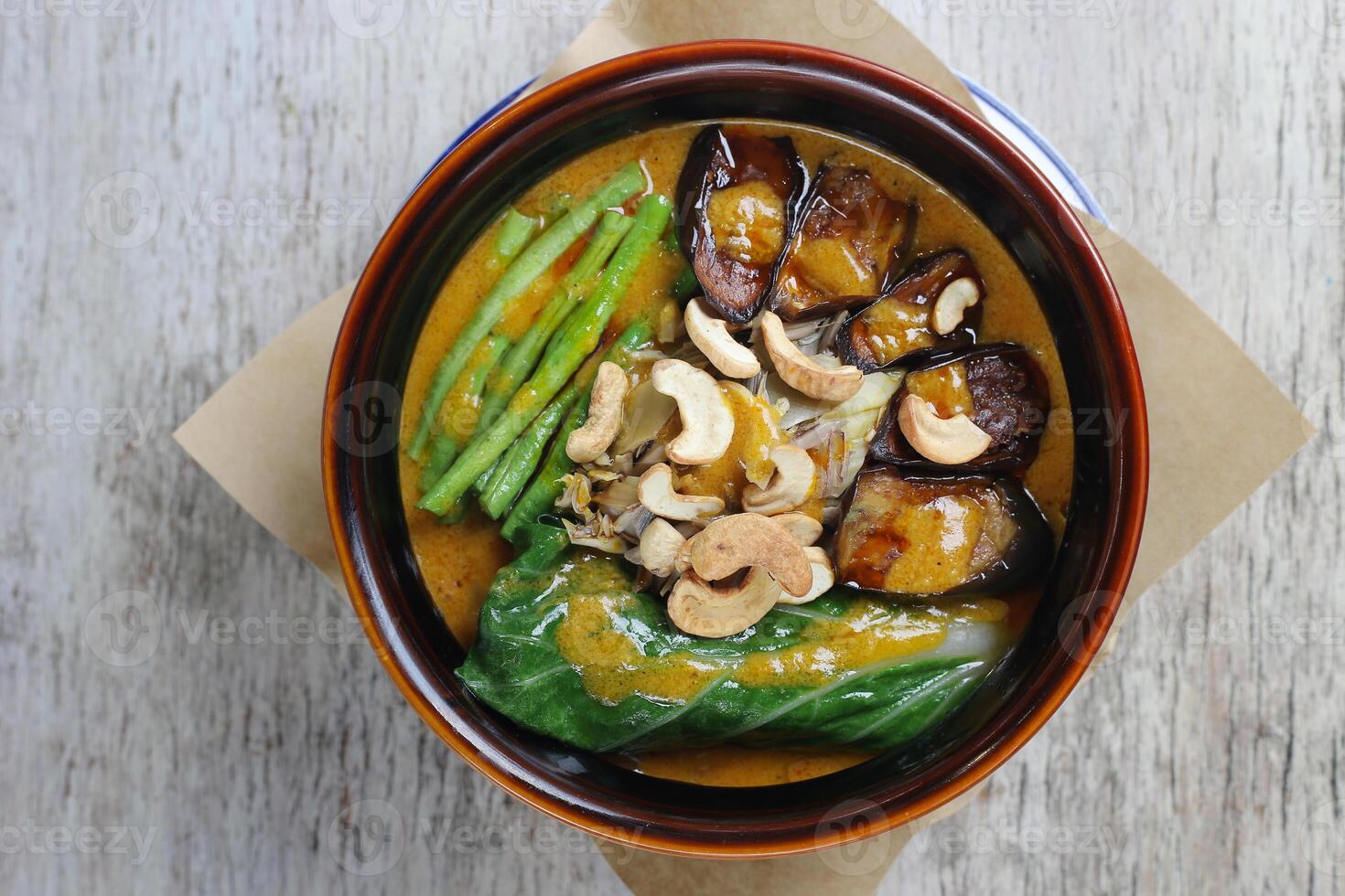 Beef Kare Kare sa Buntot with nuts served in a dish isolated on grey background side view photo