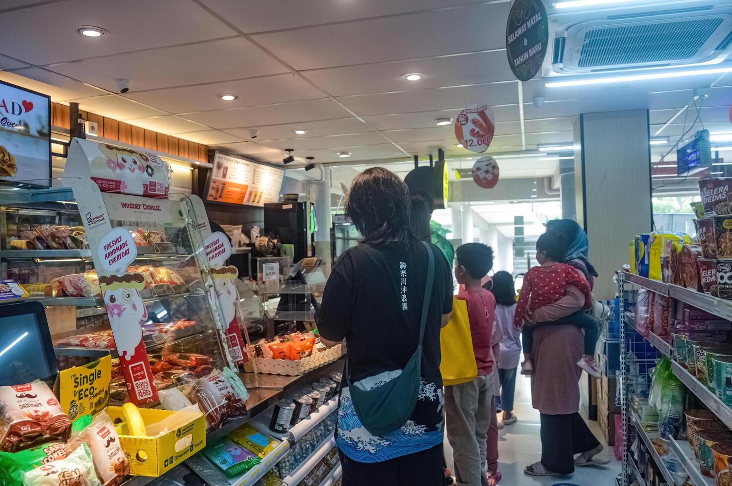 atmosphere of queue of buyers at convenience stores and minimarkets Indomaret, Indonesia, 23 December 2023. photo