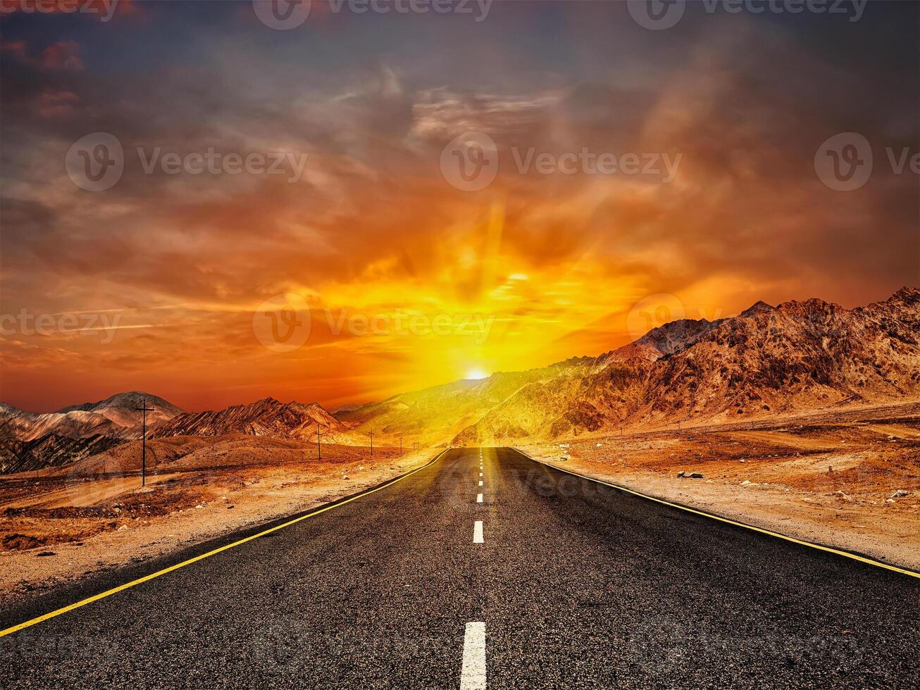 Road in Himalayas with mountains photo