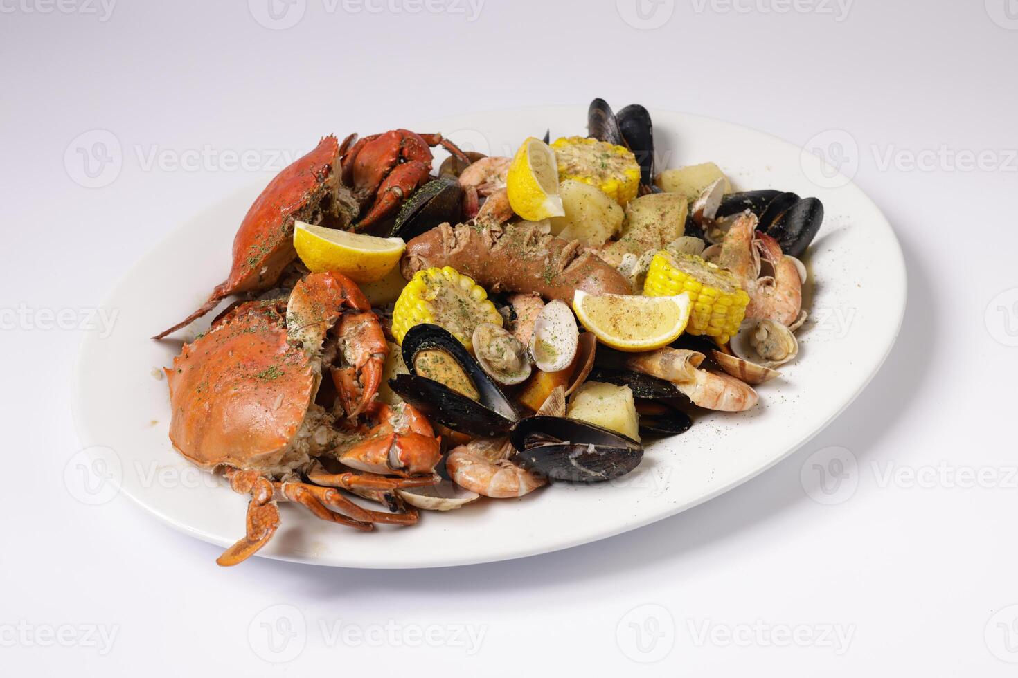 CRAB AND SEAFOOD CLAWDADDY BOIL in a dish top view on grey background singapore food photo