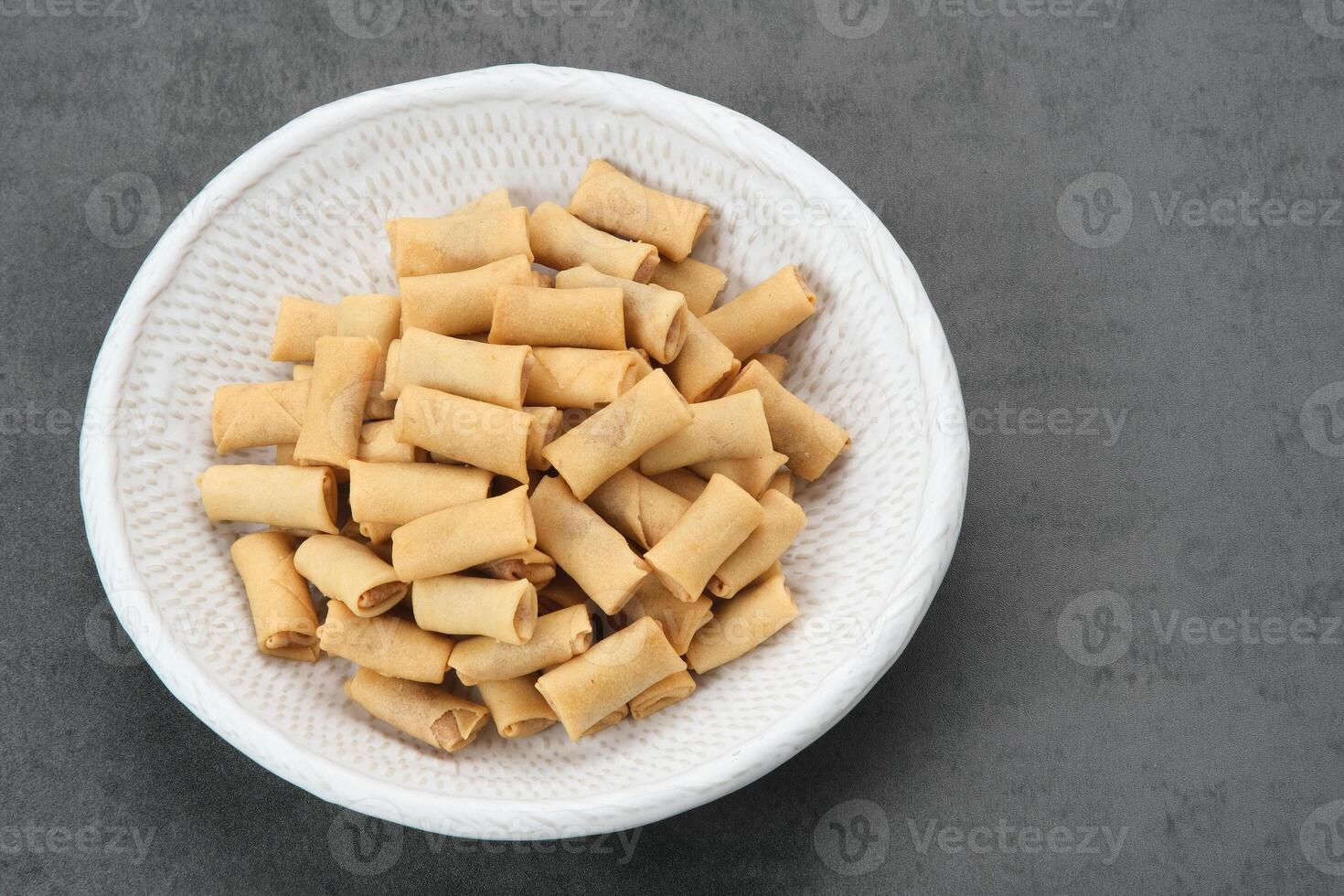 Sumpia, Indonesian traditional pastry snack with crunchy texture and savory taste with shrimp floss filling inside photo