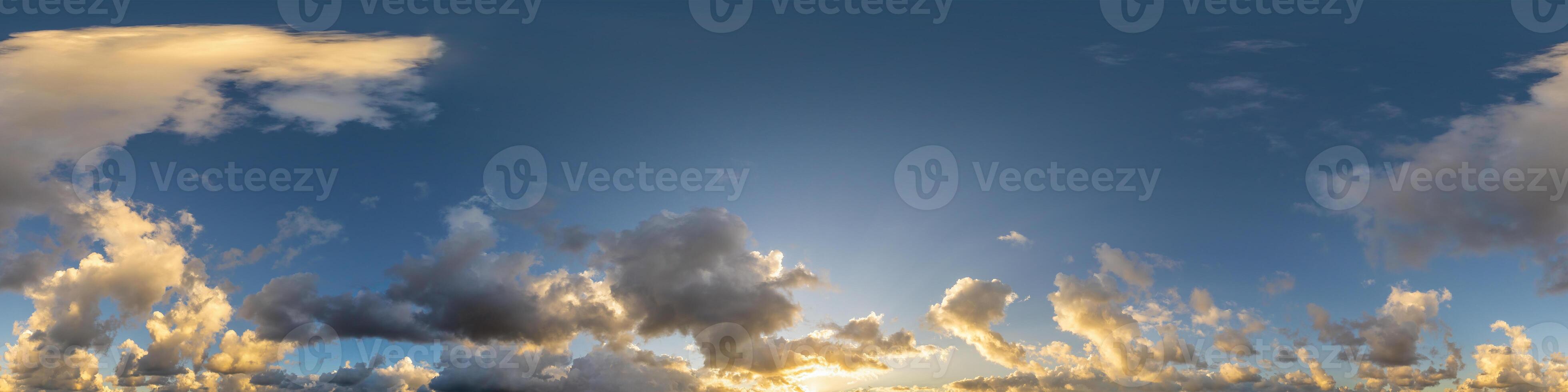 Dark blue sunset sky panorama with Cumulus clouds. Seamless hdr pano in spherical equirectangular format. Complete zenith for 3D visualization, game and sky replacement for aerial drone 360 panoramas. photo