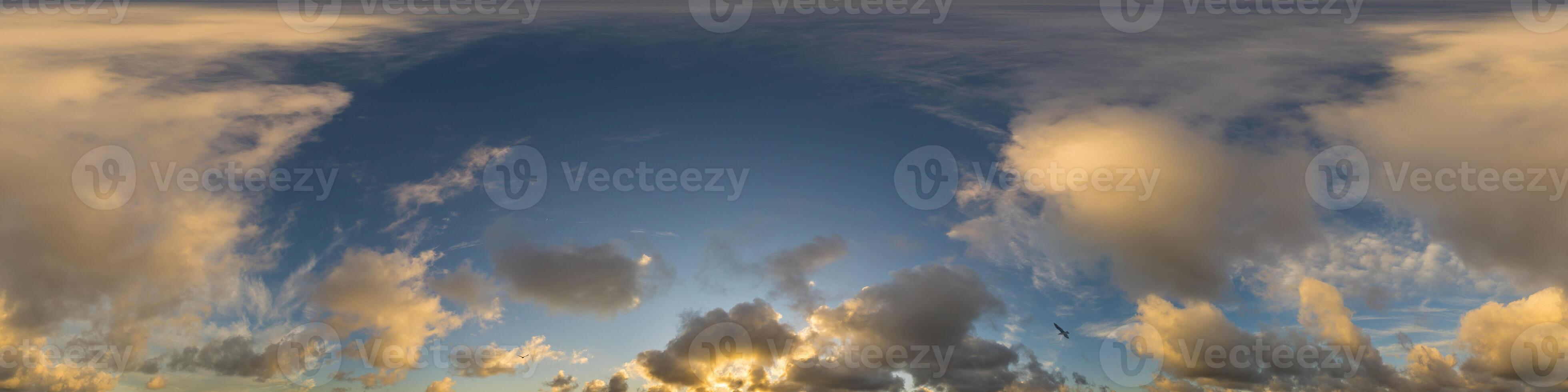 Dark blue sunset sky panorama with Cumulus clouds. Seamless hdr pano in spherical equirectangular format. Complete zenith for 3D visualization, game and sky replacement for aerial drone 360 panoramas. photo