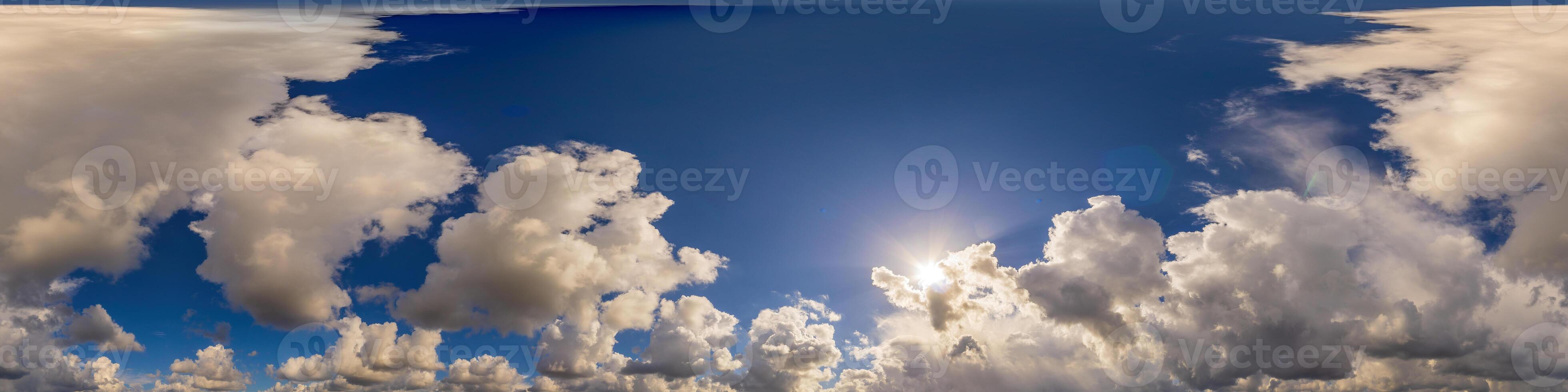 Blue sky panorama with puffy Cumulus clouds. Seamless hdr pano in spherical equirectangular format. Sky dome or zenith for 3D visualization, game and sky replacement for aerial drone 360 panoramas. photo