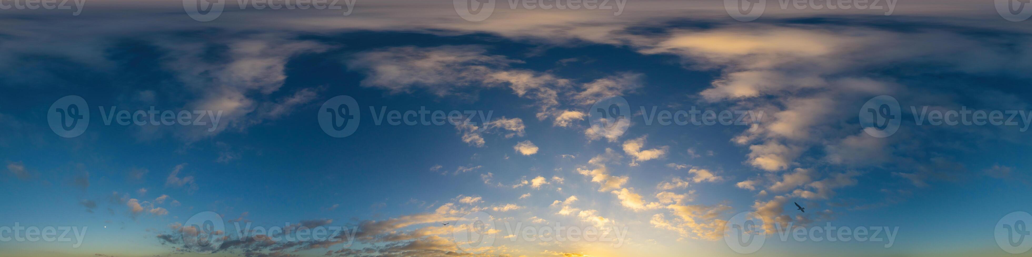 Dark blue sunset sky panorama with Cumulus clouds. Seamless hdr pano in spherical equirectangular format. Complete zenith for 3D visualization, game and sky replacement for aerial drone 360 panoramas. photo