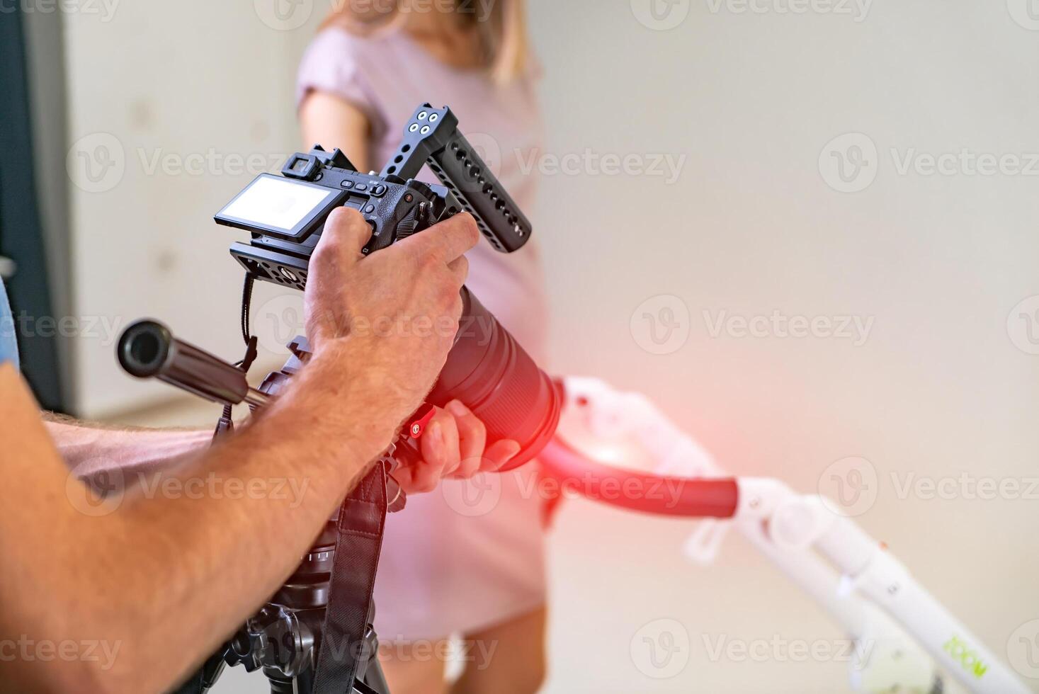 Filming professional video production. Cameraman setting the camera. photo