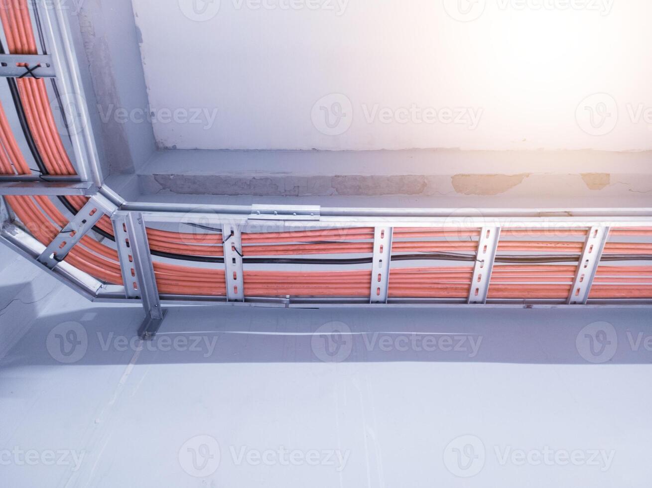 Installation cables power on the tray with spesification  fire temperature resiatance, Installation cables tray on the wall power house. power cables out inverter solar panel. photo