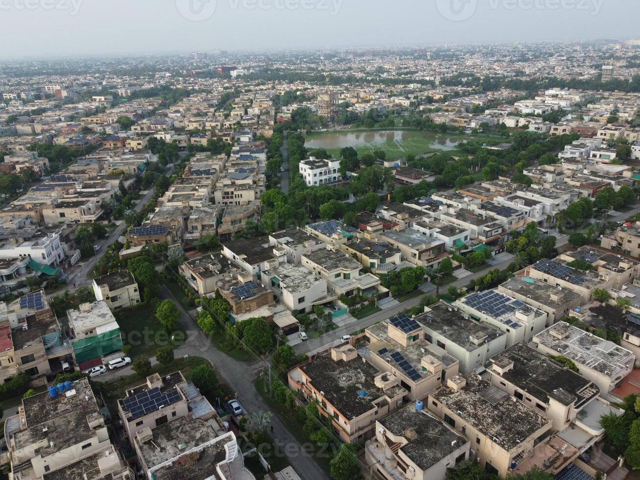 Rectangular shaped settlement of the rich district, looking down aerial view from above Bird eye view villas with pool on 2023-07-22 in Lahore Pakistan photo