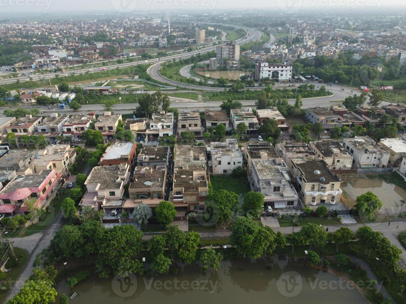 Rectangular shaped settlement of the rich district, looking down aerial view from above Bird eye view villas with pool on 2023-07-22 in Lahore Pakistan photo