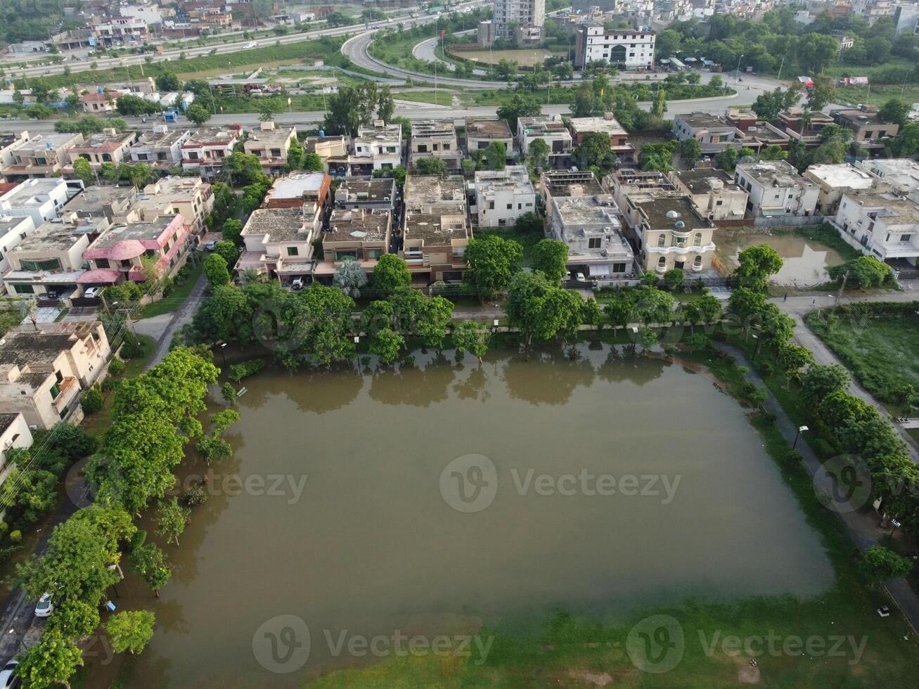 Rectangular shaped settlement of the rich district, looking down aerial view from above Bird eye view villas with pool on 2023-07-22 in Lahore Pakistan photo