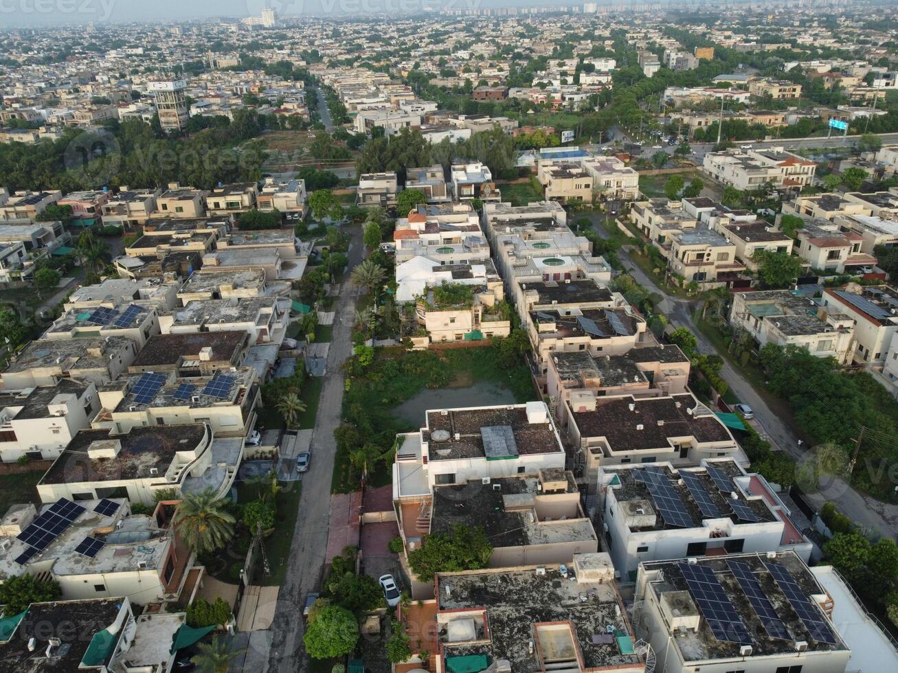 View at city from bird sight. City from drone. Aerial photo. City scape from drone on 2023-07-22 in Lahore Pakistan photo