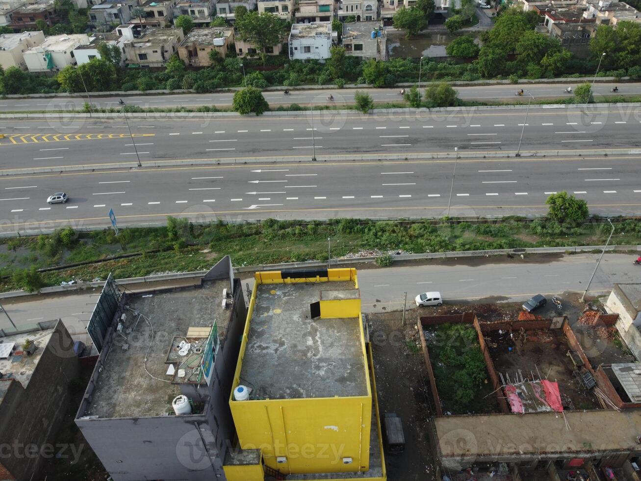 View at city from bird sight. City from drone. Aerial photo. City scape from drone on 2023-07-22 in Lahore Pakistan photo