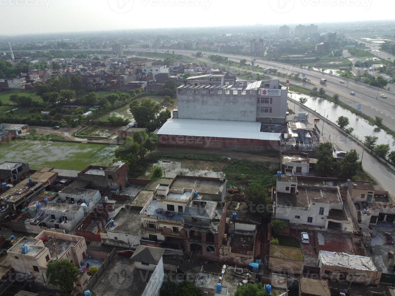View at city from bird sight. City from drone. Aerial photo. City scape from drone on 2023-07-22 in Lahore Pakistan photo
