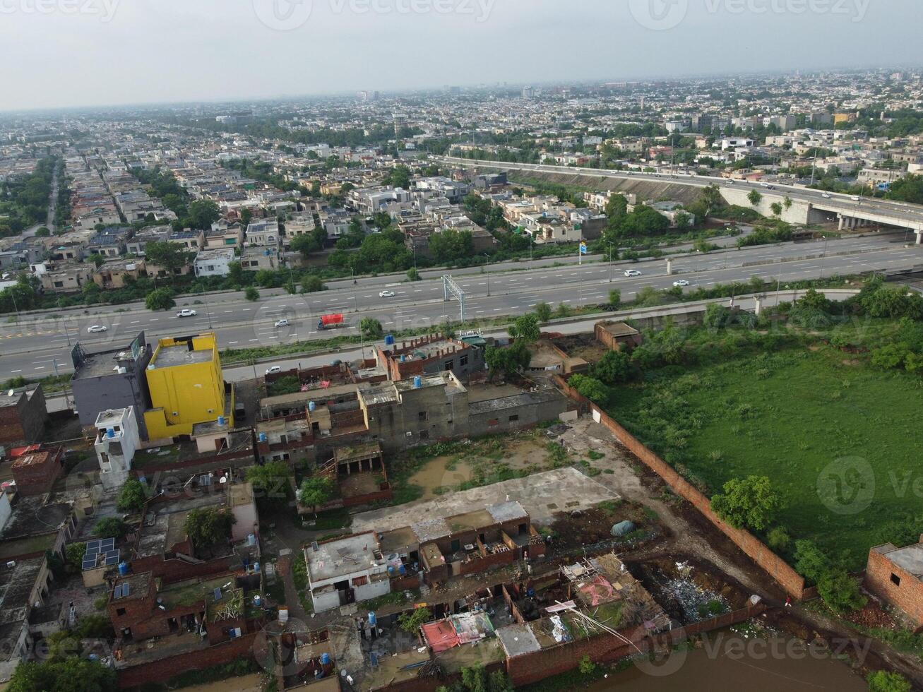View at city from bird sight. City from drone. Aerial photo. City scape from drone on 2023-07-22 in Lahore Pakistan photo