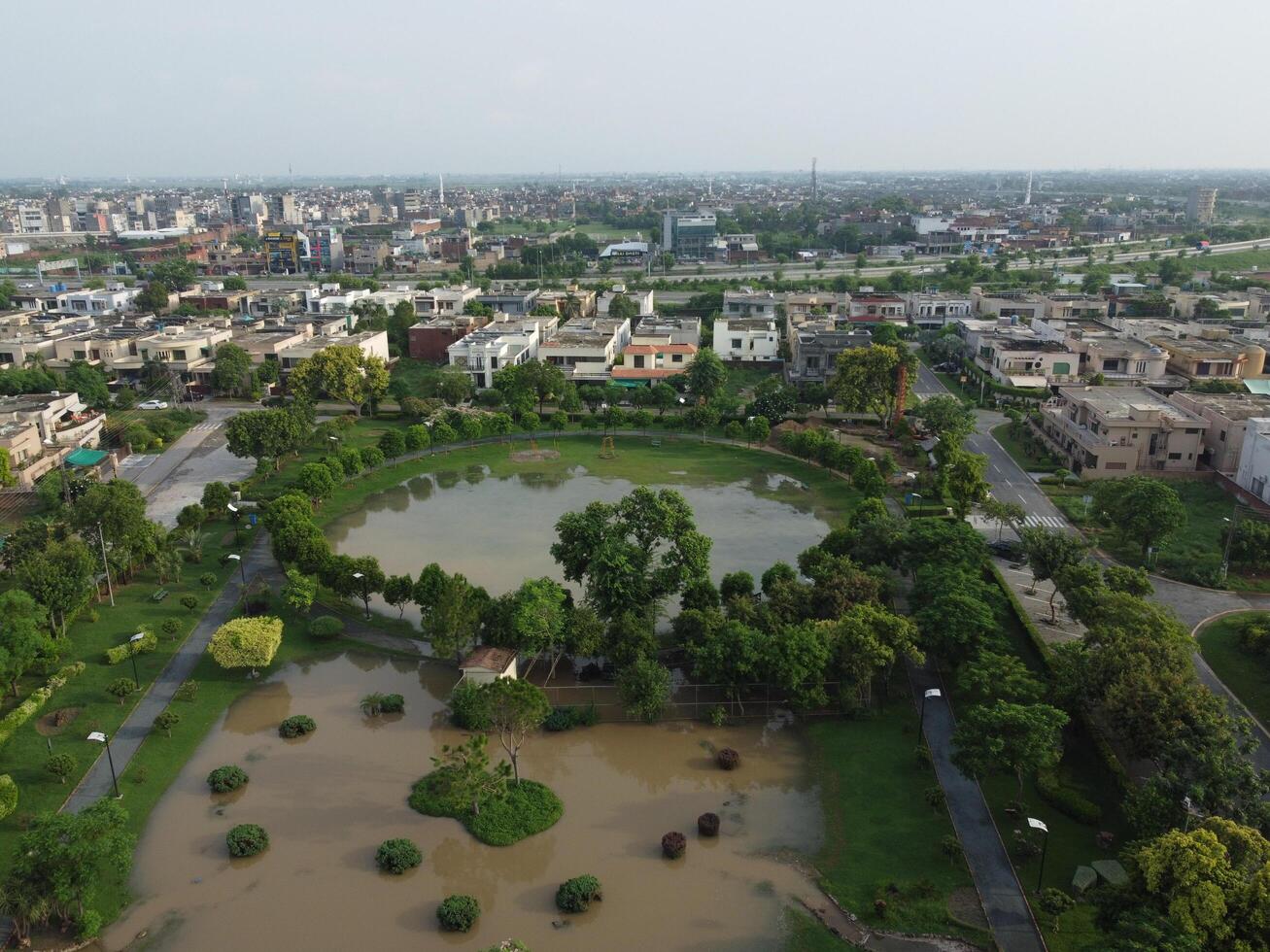 View at city from bird sight. City from drone. Aerial photo. City scape from drone on 2023-07-22 in Lahore Pakistan photo