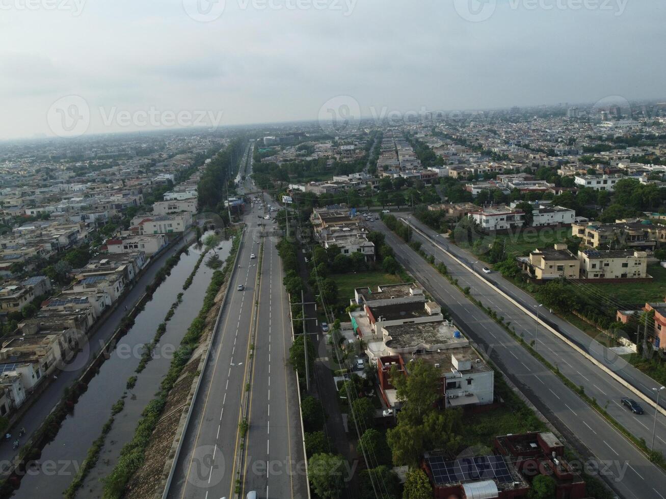 View at city from bird sight. City from drone. Aerial photo. City scape from drone on 2023-07-22 in Lahore Pakistan photo