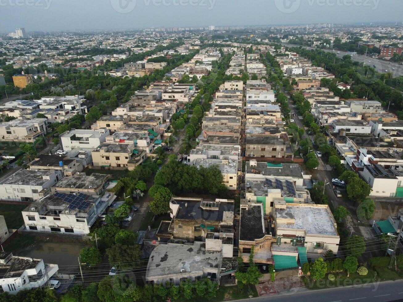 View at city from bird sight. City from drone. Aerial photo. City scape from drone on 2023-07-22 in Lahore Pakistan photo