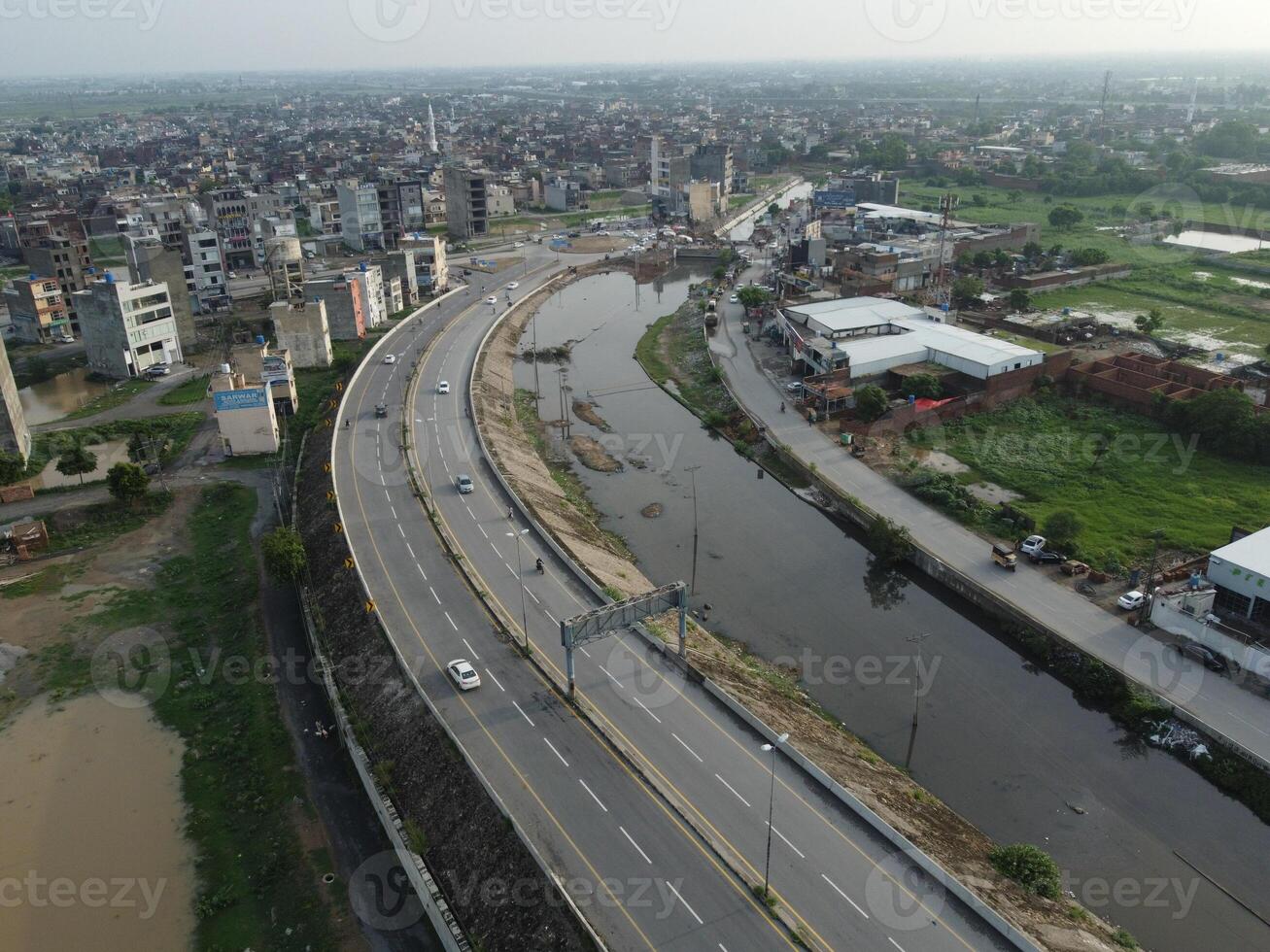 View at city from bird sight. City from drone. Aerial photo. City scape from drone on 2023-07-22 in Lahore Pakistan photo