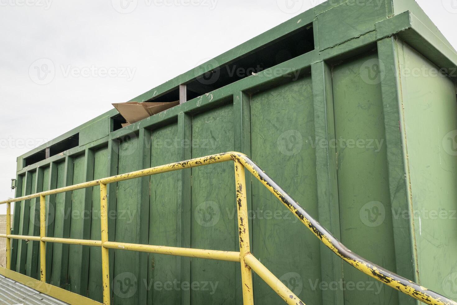 green steel container for recycling cardboard at recycling center, Colorado foothills photo