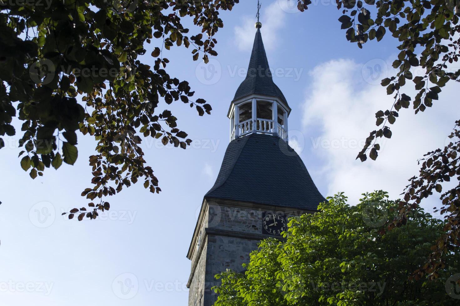 The clock tower. Old Catholic Church. photo