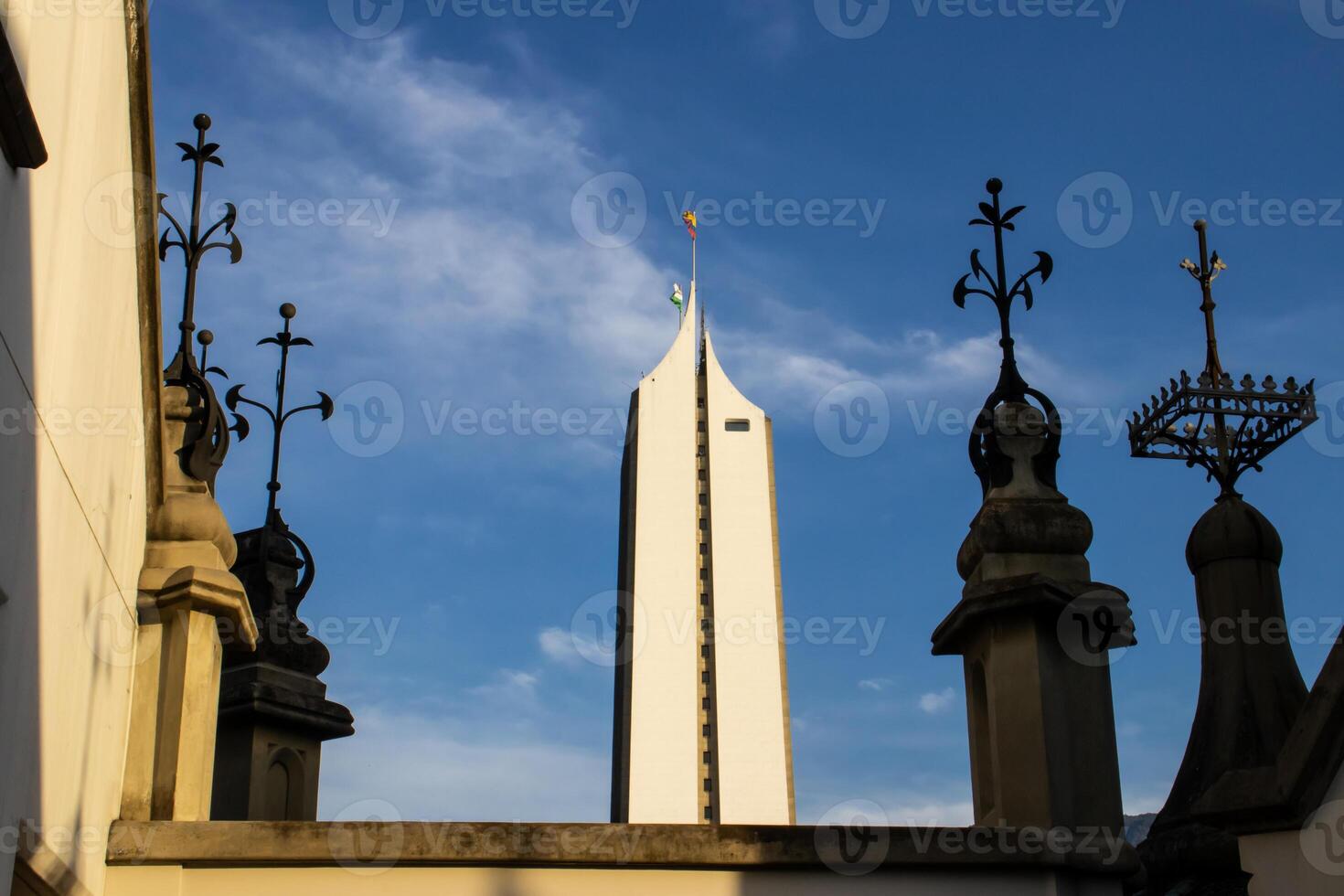 Detail of the historic, Gothic Revival style, Rafael Uribe Uribe Palace of Culture locate in Medellin declared National Monument of Colombia in 1982 and the Coltejer building. photo