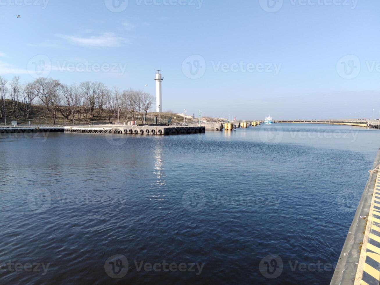 Taking a stroll along the port and pier in Kolobrzeg, Poland, offers a delightful experience with picturesque views of the Baltic Sea and the bustling maritime activity. photo