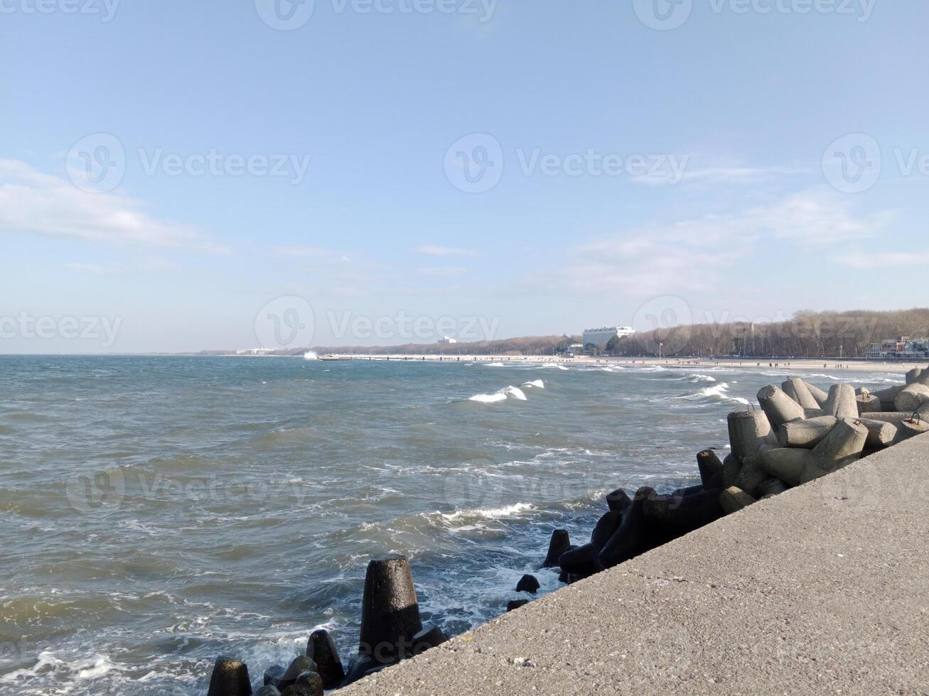 Taking a stroll along the port and pier in Kolobrzeg, Poland, offers a delightful experience with picturesque views of the Baltic Sea and the bustling maritime activity. photo