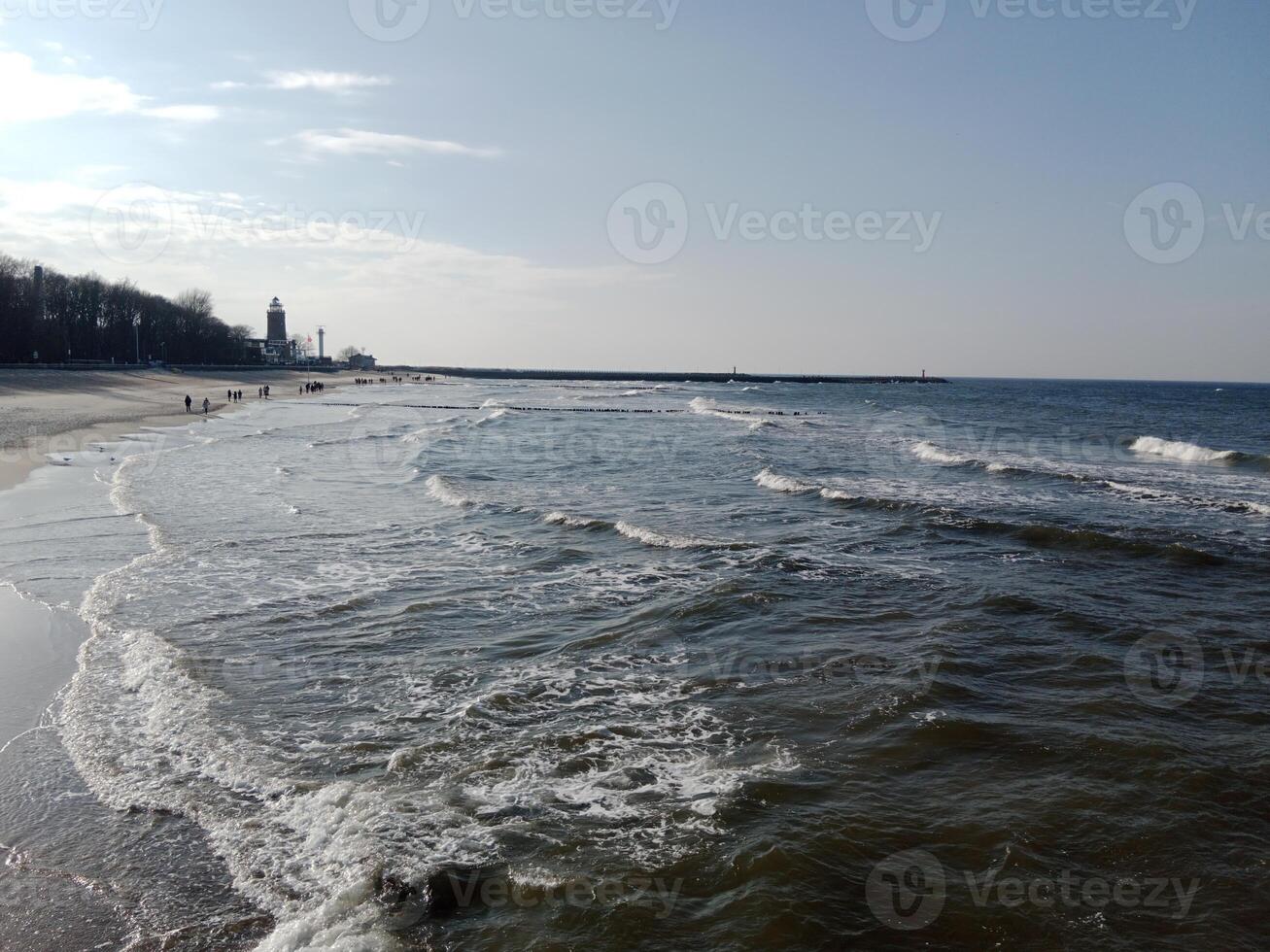 Taking a stroll along the port and pier in Kolobrzeg, Poland, offers a delightful experience with picturesque views of the Baltic Sea and the bustling maritime activity. photo