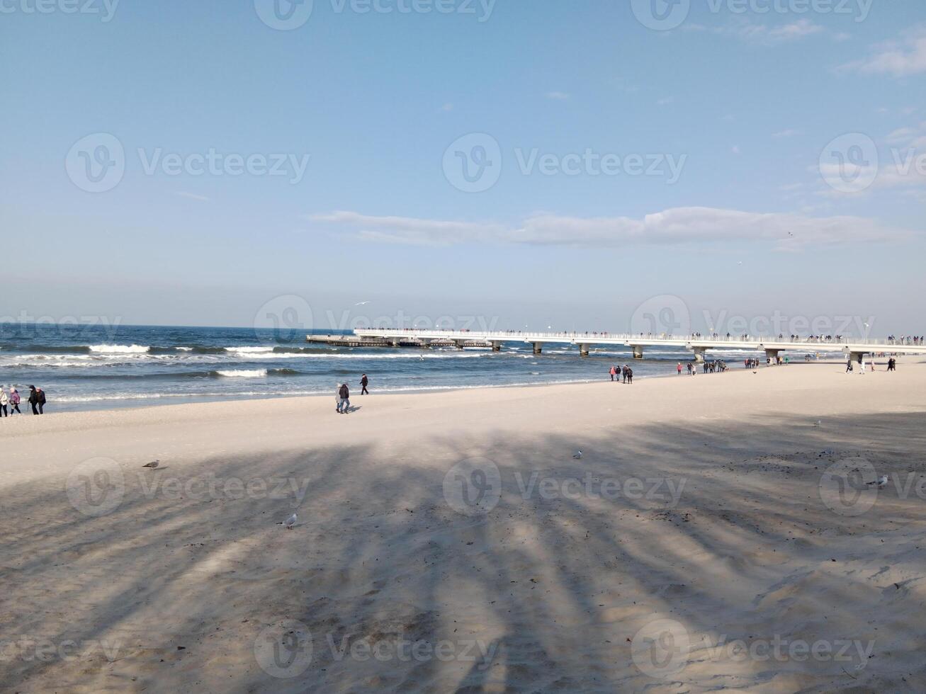 Taking a stroll along the port and pier in Kolobrzeg, Poland, offers a delightful experience with picturesque views of the Baltic Sea and the bustling maritime activity. photo