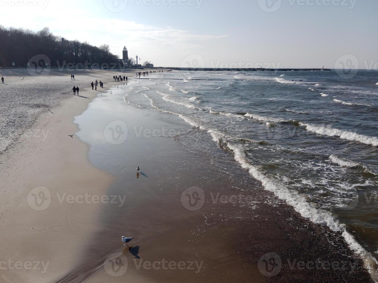 Taking a stroll along the port and pier in Kolobrzeg, Poland, offers a delightful experience with picturesque views of the Baltic Sea and the bustling maritime activity. photo