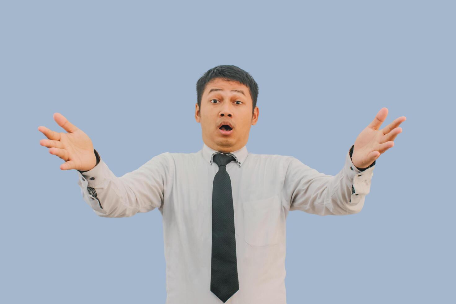 Adult Asian man shocked expression with both hands open photo