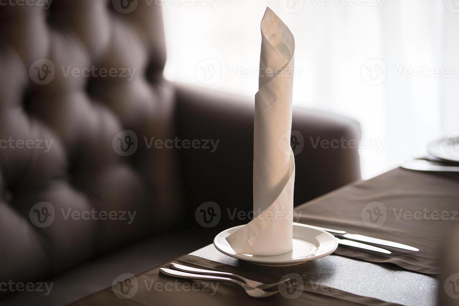 Plate with napkin and cutlery.Restaurant table photo