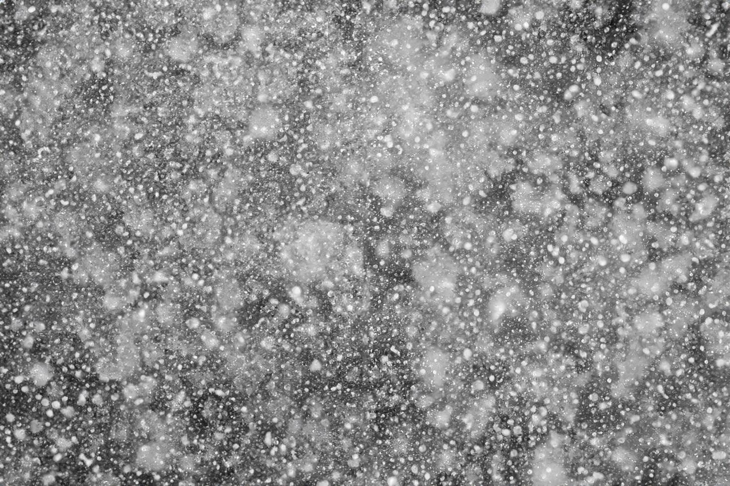 Falling Snowflakes on a Black Background, Enhance Your Project with Snowy Texture. Use as a 'Screen' Layer in Photo Editor for Effortless Snow Integration.