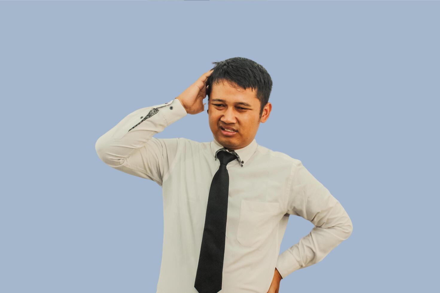 Adult Asian man showing confused expression photo